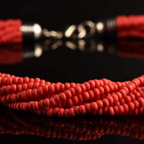 Collana Torchon Mat di Murano, 9 fili intrecciati di rare perle conteria satinato pastello vintage anni '80 (lunghezza circa 50 cm), chiusura anallergica.